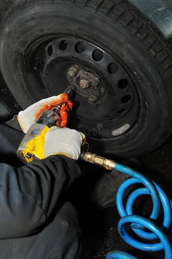 Tyre fitting with air compressed wrench