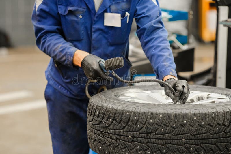 Tyre repair working shop stock image. Image of labor 104351047