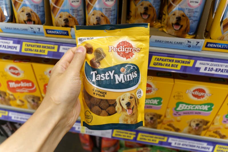 Tyumen, Russia-June 30, 2022: Pedigree Tasty Minis Petfoods dog food, selective focus. Buying goods in the supermarket
