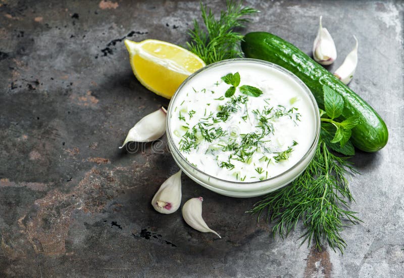 Tzatziki sauce cucumber garlic dill Food background