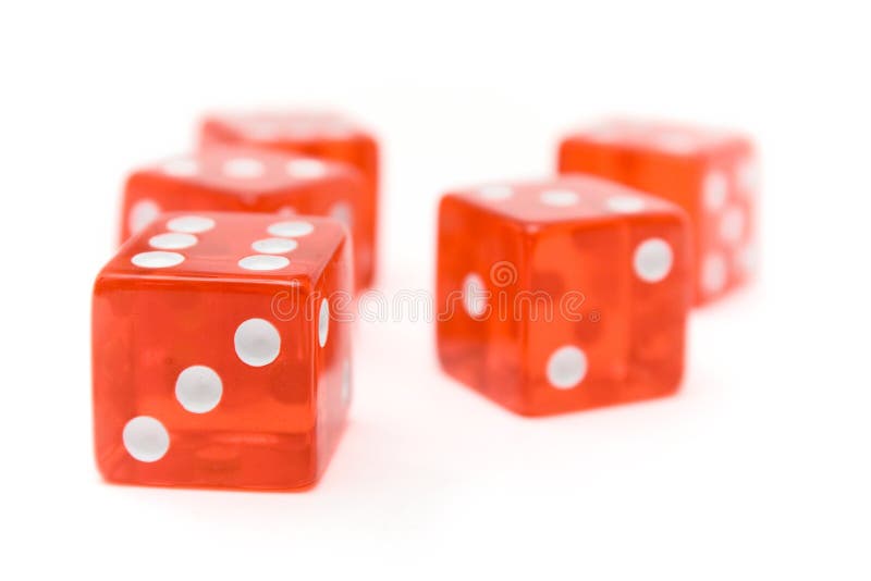 Translucent red dice isolated on a white background. Shallow depth of field. Translucent red dice isolated on a white background. Shallow depth of field.