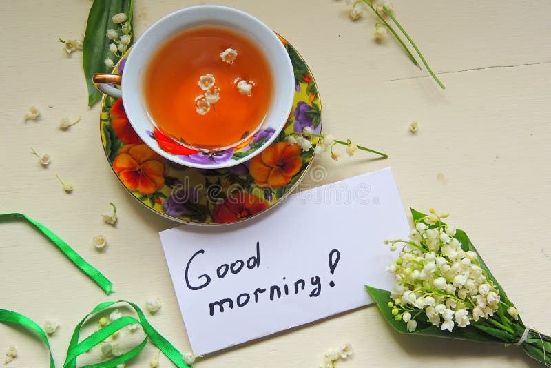 Tè e mughetti fotografia stock