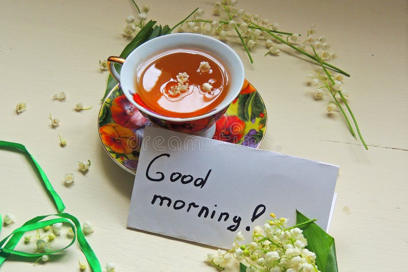 Tè e mughetti fotografia stock