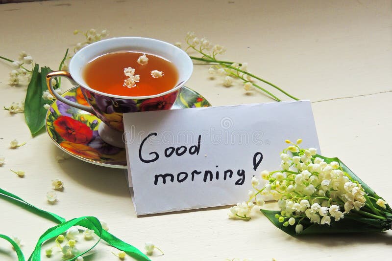 Tè e mughetti fotografia stock