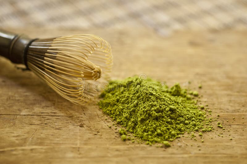 Bowl of matcha on wooden background. Bowl of matcha on wooden background