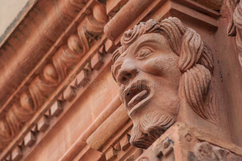 Closeup of stoned head on building facade. Closeup of stoned head on building facade