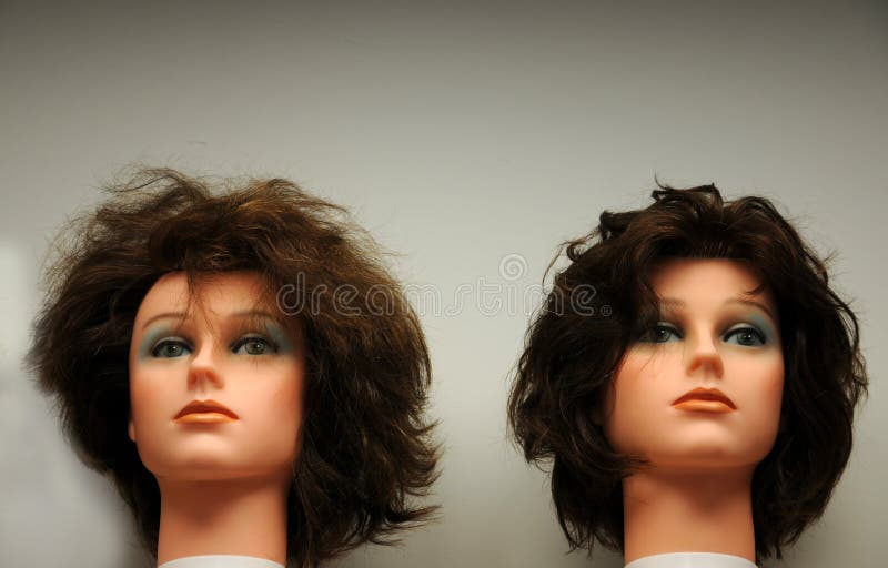 Mannequins heads in a hair stylist studio. Mannequins heads in a hair stylist studio.