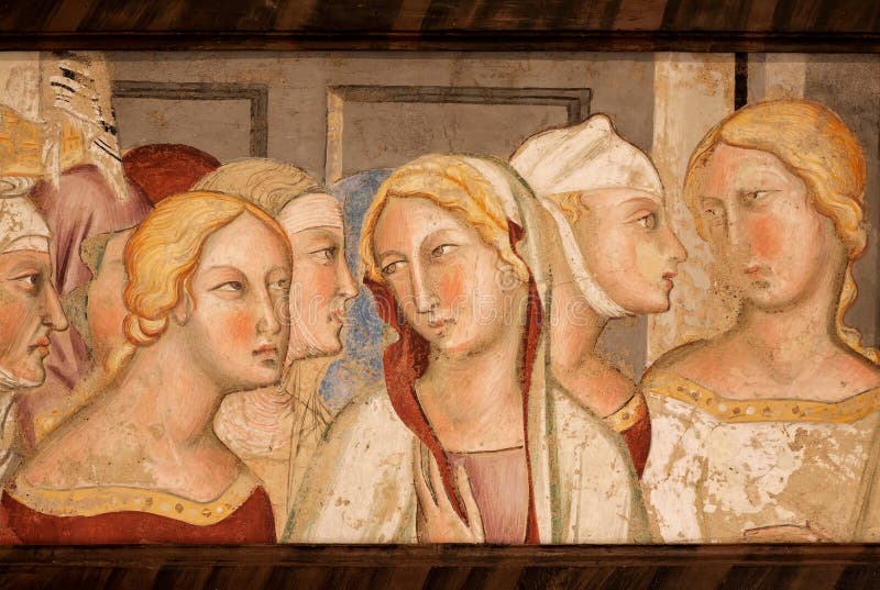SAN GIMINIANO, ITALY - SEP 19: Female heads on 14th century fresco inside historical Palazzo del Podesta on 19 September 2018. Historic Centre of San Gimignano is UNESCO World Heritage Site. SAN GIMINIANO, ITALY - SEP 19: Female heads on 14th century fresco inside historical Palazzo del Podesta on 19 September 2018. Historic Centre of San Gimignano is UNESCO World Heritage Site