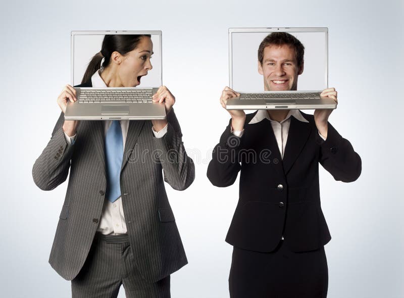 A male and female with swapped heads on their laptops. A male and female with swapped heads on their laptops