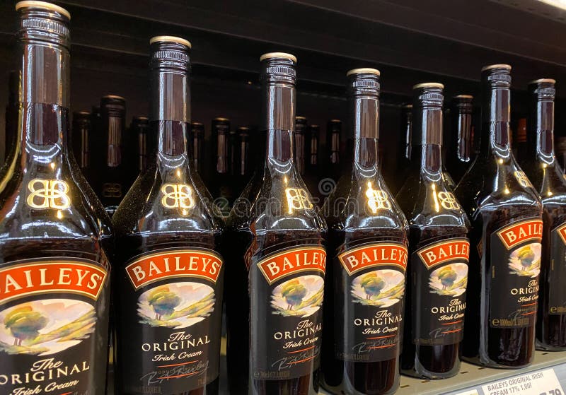 Close up of isolated Baileys irish cream bottles in shelf of german supermarket