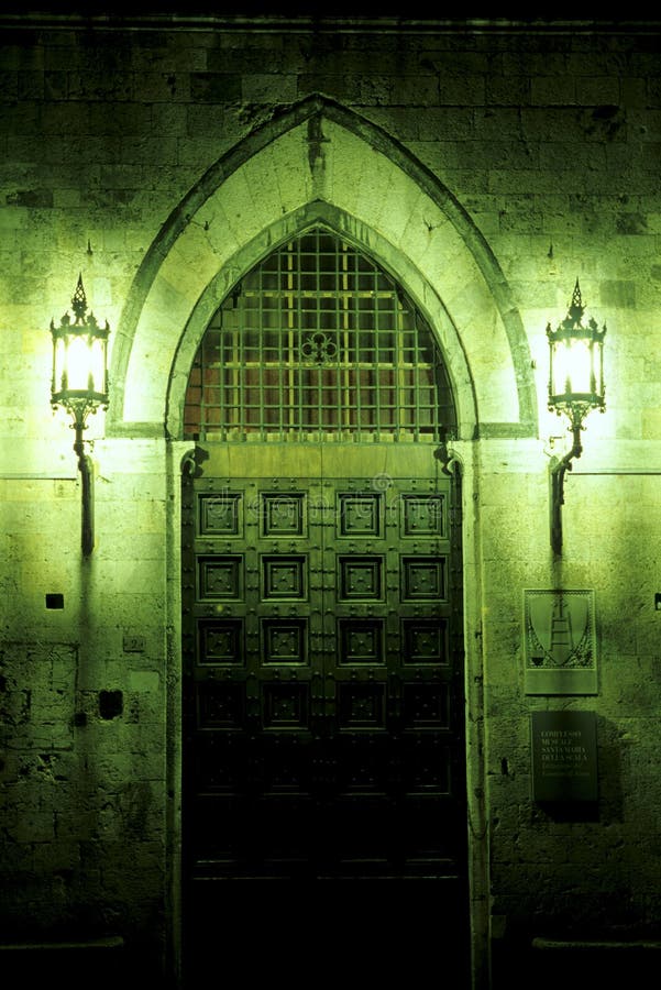 Lights framing entrance to the Complesso Museale di Santa Maria della Scala in the medieval city of Siena, Italy. Lights framing entrance to the Complesso Museale di Santa Maria della Scala in the medieval city of Siena, Italy