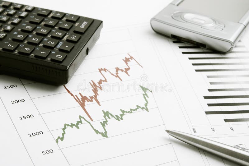 Business background with finance graphs, pen, calculator and PDA. Business background with finance graphs, pen, calculator and PDA