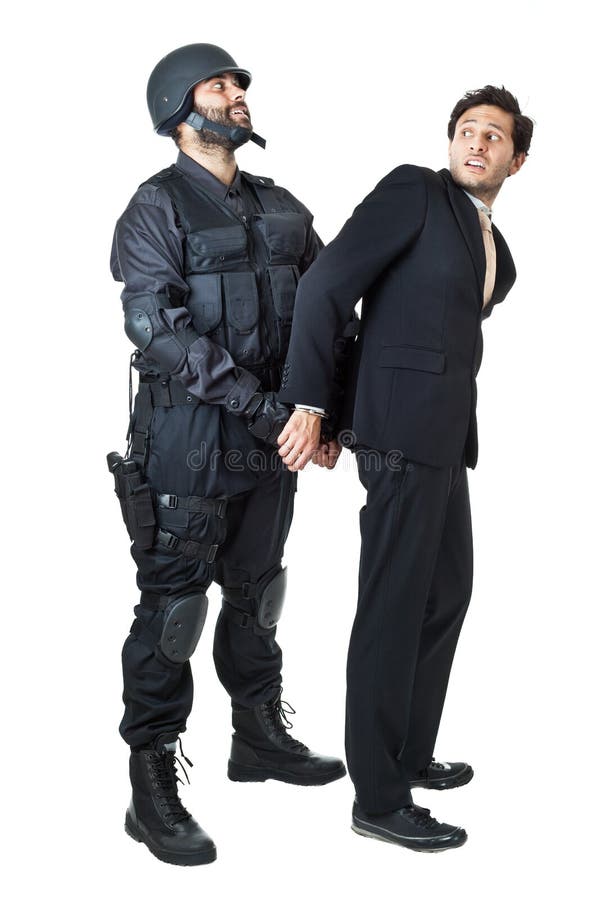 A corrupted businessman being arrested by a swat agent. A corrupted businessman being arrested by a swat agent