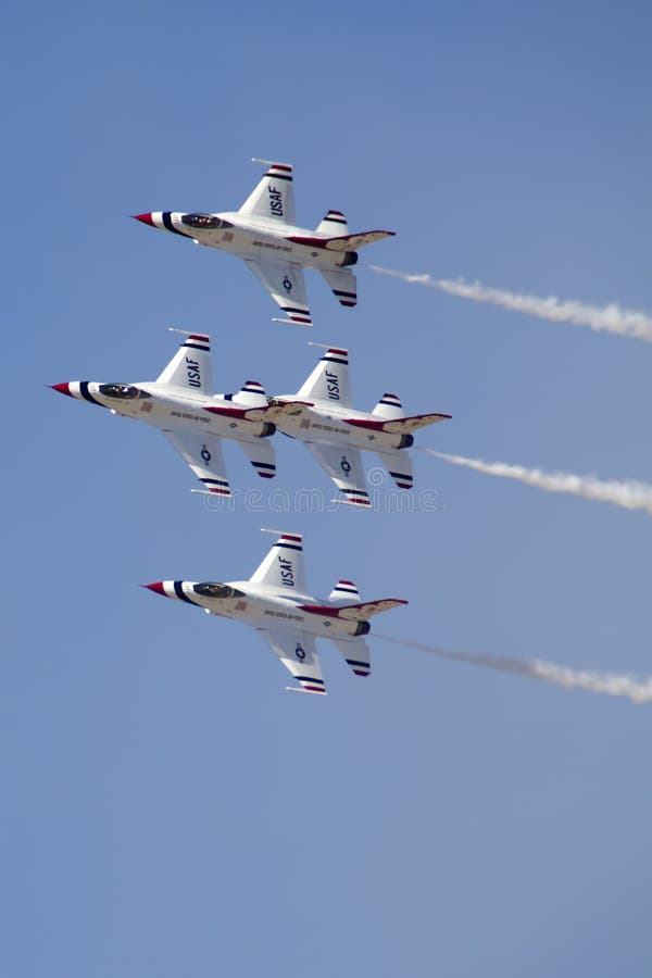 The United States Air Force Thunderbirds Air Demonstration Squadron performs for spectators at Luke Air Force Base in Glendale, Arizona, USA. These highly trained United State Air Force pilots fly in very close high precision aerobatic formations in air shows throughout the United States and around the world. The name Thunderbird is derived from a legendary creature from myths of indigenous North American cultures. The Thunderbirds fly specially marked F-16's. The F-16 (Fighting Falcon) is a very prominent and successful jet fighter aircraft developed by General Dynamics and Lockheed Martin of the United States. Designed as a lightweight fighter, it has evolved to being a highly successful multirole aircraft. In addition to air demonstrations, the USAF Thunderbirds are part of the Air Force combat forces and a component of the 57th Wing. If needed, the team's personnel and aircraft can be rapidly integrated into a fighter unit at their home base Nellis Air Force Base, Nevada. The United States Air Force Thunderbirds Air Demonstration Squadron performs for spectators at Luke Air Force Base in Glendale, Arizona, USA. These highly trained United State Air Force pilots fly in very close high precision aerobatic formations in air shows throughout the United States and around the world. The name Thunderbird is derived from a legendary creature from myths of indigenous North American cultures. The Thunderbirds fly specially marked F-16's. The F-16 (Fighting Falcon) is a very prominent and successful jet fighter aircraft developed by General Dynamics and Lockheed Martin of the United States. Designed as a lightweight fighter, it has evolved to being a highly successful multirole aircraft. In addition to air demonstrations, the USAF Thunderbirds are part of the Air Force combat forces and a component of the 57th Wing. If needed, the team's personnel and aircraft can be rapidly integrated into a fighter unit at their home base Nellis Air Force Base, Nevada.