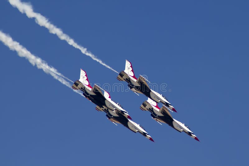 The United States Air Force Thunderbirds Air Demonstration Squadron performs for spectators at Luke Air Force Base in Glendale, Arizona, USA. These highly trained United State Air Force pilots fly in very close high precision aerobatic formations in air shows throughout the United States and around the world. The name Thunderbird is derived from a legendary creature from myths of indigenous North American cultures. The Thunderbirds fly specially marked F-16's. The F-16 (Fighting Falcon) is a very prominent and successful jet fighter aircraft developed by General Dynamics and Lockheed Martin of the United States. Designed as a lightweight fighter, it has evolved to being a highly successful multirole aircraft. In addition to air demonstrations, the USAF Thunderbirds are part of the Air Force combat forces and a component of the 57th Wing. If needed, the team's personnel and aircraft can be rapidly integrated into a fighter unit at their home base Nellis Air Force Base, Nevada. The United States Air Force Thunderbirds Air Demonstration Squadron performs for spectators at Luke Air Force Base in Glendale, Arizona, USA. These highly trained United State Air Force pilots fly in very close high precision aerobatic formations in air shows throughout the United States and around the world. The name Thunderbird is derived from a legendary creature from myths of indigenous North American cultures. The Thunderbirds fly specially marked F-16's. The F-16 (Fighting Falcon) is a very prominent and successful jet fighter aircraft developed by General Dynamics and Lockheed Martin of the United States. Designed as a lightweight fighter, it has evolved to being a highly successful multirole aircraft. In addition to air demonstrations, the USAF Thunderbirds are part of the Air Force combat forces and a component of the 57th Wing. If needed, the team's personnel and aircraft can be rapidly integrated into a fighter unit at their home base Nellis Air Force Base, Nevada.