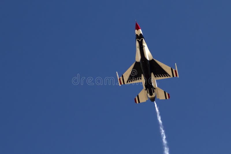 The United States Air Force Thunderbirds Air Demonstration Squadron performs for spectators at Luke Air Force Base in Glendale, Arizona, USA. These highly trained United State Air Force pilots fly in very close high precision aerobatic formations in air shows throughout the United States and around the world. The name Thunderbird is derived from a legendary creature from myths of indigenous North American cultures. The Thunderbirds fly specially marked F-16's. The F-16 (Fighting Falcon) is a very prominent and successful jet fighter aircraft developed by General Dynamics and Lockheed Martin of the United States. Designed as a lightweight fighter, it has evolved to being a highly successful multirole aircraft. In addition to air demonstrations, the USAF Thunderbirds are part of the Air Force combat forces and a component of the 57th Wing. If needed, the team's personnel and aircraft can be rapidly integrated into a fighter unit at their home base Nellis Air Force Base, Nevada. The United States Air Force Thunderbirds Air Demonstration Squadron performs for spectators at Luke Air Force Base in Glendale, Arizona, USA. These highly trained United State Air Force pilots fly in very close high precision aerobatic formations in air shows throughout the United States and around the world. The name Thunderbird is derived from a legendary creature from myths of indigenous North American cultures. The Thunderbirds fly specially marked F-16's. The F-16 (Fighting Falcon) is a very prominent and successful jet fighter aircraft developed by General Dynamics and Lockheed Martin of the United States. Designed as a lightweight fighter, it has evolved to being a highly successful multirole aircraft. In addition to air demonstrations, the USAF Thunderbirds are part of the Air Force combat forces and a component of the 57th Wing. If needed, the team's personnel and aircraft can be rapidly integrated into a fighter unit at their home base Nellis Air Force Base, Nevada.