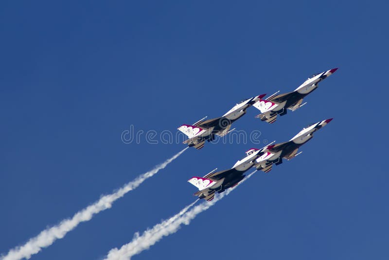 The United States Air Force Thunderbirds Air Demonstration Squadron performs for spectators at Luke Air Force Base in Glendale, Arizona, USA. These highly trained United State Air Force pilots fly in very close high precision aerobatic formations in air shows throughout the United States and around the world. The name Thunderbird is derived from a legendary creature from myths of indigenous North American cultures. The Thunderbirds fly specially marked F-16's. The F-16 (Fighting Falcon) is a very prominent and successful jet fighter aircraft developed by General Dynamics and Lockheed Martin of the United States. Designed as a lightweight fighter, it has evolved to being a highly successful multirole aircraft. In addition to air demonstrations, the USAF Thunderbirds are part of the Air Force combat forces and a component of the 57th Wing. If needed, the team's personnel and aircraft can be rapidly integrated into a fighter unit at their home base Nellis Air Force Base, Nevada. The United States Air Force Thunderbirds Air Demonstration Squadron performs for spectators at Luke Air Force Base in Glendale, Arizona, USA. These highly trained United State Air Force pilots fly in very close high precision aerobatic formations in air shows throughout the United States and around the world. The name Thunderbird is derived from a legendary creature from myths of indigenous North American cultures. The Thunderbirds fly specially marked F-16's. The F-16 (Fighting Falcon) is a very prominent and successful jet fighter aircraft developed by General Dynamics and Lockheed Martin of the United States. Designed as a lightweight fighter, it has evolved to being a highly successful multirole aircraft. In addition to air demonstrations, the USAF Thunderbirds are part of the Air Force combat forces and a component of the 57th Wing. If needed, the team's personnel and aircraft can be rapidly integrated into a fighter unit at their home base Nellis Air Force Base, Nevada.