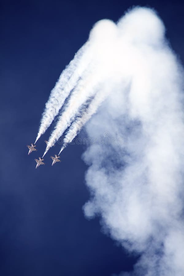 The United States Air Force Thunderbirds Air Demonstration Squadron performs for spectators at Luke Air Force Base in Glendale, Arizona, USA. These highly trained United State Air Force pilots fly in very close high precision aerobatic formations in air shows throughout the United States and around the world. The name Thunderbird is derived from a legendary creature from myths of indigenous North American cultures. The Thunderbirds fly specially marked F-16's. The F-16 (Fighting Falcon) is a very prominent and successful jet fighter aircraft developed by General Dynamics and Lockheed Martin of the United States. Designed as a lightweight fighter, it has evolved to being a highly successful multirole aircraft. In addition to air demonstrations, the USAF Thunderbirds are part of the Air Force combat forces and a component of the 57th Wing. If needed, the team's personnel and aircraft can be rapidly integrated into a fighter unit at their home base Nellis Air Force Base, Nevada. The United States Air Force Thunderbirds Air Demonstration Squadron performs for spectators at Luke Air Force Base in Glendale, Arizona, USA. These highly trained United State Air Force pilots fly in very close high precision aerobatic formations in air shows throughout the United States and around the world. The name Thunderbird is derived from a legendary creature from myths of indigenous North American cultures. The Thunderbirds fly specially marked F-16's. The F-16 (Fighting Falcon) is a very prominent and successful jet fighter aircraft developed by General Dynamics and Lockheed Martin of the United States. Designed as a lightweight fighter, it has evolved to being a highly successful multirole aircraft. In addition to air demonstrations, the USAF Thunderbirds are part of the Air Force combat forces and a component of the 57th Wing. If needed, the team's personnel and aircraft can be rapidly integrated into a fighter unit at their home base Nellis Air Force Base, Nevada.