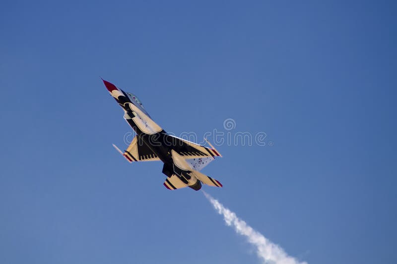 The United States Air Force Thunderbirds Air Demonstration Squadron performs for spectators at Luke Air Force Base in Glendale, Arizona, USA. These highly trained United State Air Force pilots fly in very close high precision aerobatic formations in air shows throughout the United States and around the world. The name Thunderbird is derived from a legendary creature from myths of indigenous North American cultures. The Thunderbirds fly specially marked F-16's. The F-16 (Fighting Falcon) is a very prominent and successful jet fighter aircraft developed by General Dynamics and Lockheed Martin of the United States. Designed as a lightweight fighter, it has evolved to being a highly successful multirole aircraft. In addition to air demonstrations, the USAF Thunderbirds are part of the Air Force combat forces and a component of the 57th Wing. If needed, the team's personnel and aircraft can be rapidly integrated into a fighter unit at their home base Nellis Air Force Base, Nevada. The United States Air Force Thunderbirds Air Demonstration Squadron performs for spectators at Luke Air Force Base in Glendale, Arizona, USA. These highly trained United State Air Force pilots fly in very close high precision aerobatic formations in air shows throughout the United States and around the world. The name Thunderbird is derived from a legendary creature from myths of indigenous North American cultures. The Thunderbirds fly specially marked F-16's. The F-16 (Fighting Falcon) is a very prominent and successful jet fighter aircraft developed by General Dynamics and Lockheed Martin of the United States. Designed as a lightweight fighter, it has evolved to being a highly successful multirole aircraft. In addition to air demonstrations, the USAF Thunderbirds are part of the Air Force combat forces and a component of the 57th Wing. If needed, the team's personnel and aircraft can be rapidly integrated into a fighter unit at their home base Nellis Air Force Base, Nevada.