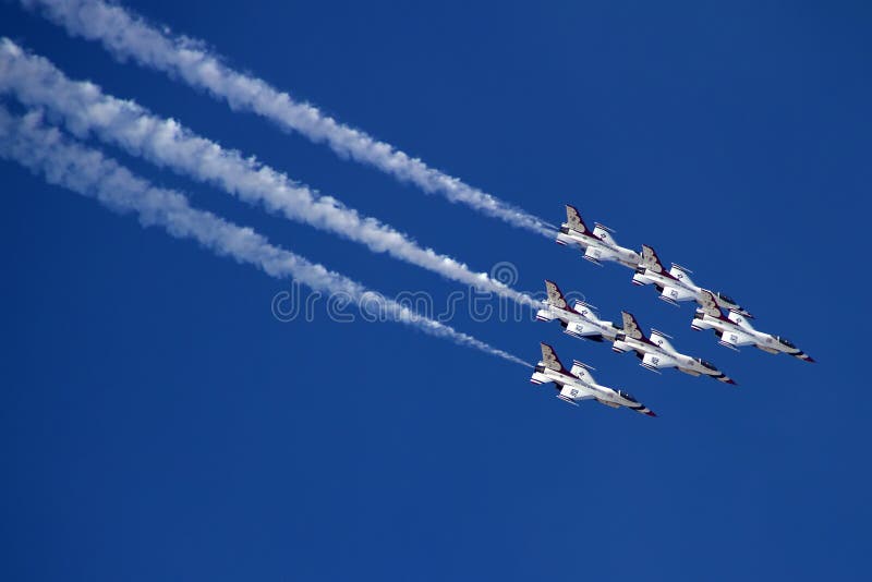 The United States Air Force Thunderbirds Air Demonstration Squadron performs for spectators at Luke Air Force Base in Glendale, Arizona, USA. These highly trained United State Air Force pilots fly in very close high precision aerobatic formations in air shows throughout the United States and around the world. The name Thunderbird is derived from a legendary creature from myths of indigenous North American cultures. The Thunderbirds fly specially marked F-16s. The F-16 (Fighting Falcon) is a very prominent and successful jet fighter aircraft developed by General Dynamics and Lockheed Martin of the United States. Designed as a lightweight fighter, it has evolved to being a highly successful multirole aircraft. In addition to air demonstrations, the USAF Thunderbirds are part of the Air Force combat forces and a component of the 57th Wing. If needed, the teams personnel and aircraft can be rapidly integrated into a fighter unit at their home base Nellis Air Force Base, Nevada. The United States Air Force Thunderbirds Air Demonstration Squadron performs for spectators at Luke Air Force Base in Glendale, Arizona, USA. These highly trained United State Air Force pilots fly in very close high precision aerobatic formations in air shows throughout the United States and around the world. The name Thunderbird is derived from a legendary creature from myths of indigenous North American cultures. The Thunderbirds fly specially marked F-16s. The F-16 (Fighting Falcon) is a very prominent and successful jet fighter aircraft developed by General Dynamics and Lockheed Martin of the United States. Designed as a lightweight fighter, it has evolved to being a highly successful multirole aircraft. In addition to air demonstrations, the USAF Thunderbirds are part of the Air Force combat forces and a component of the 57th Wing. If needed, the teams personnel and aircraft can be rapidly integrated into a fighter unit at their home base Nellis Air Force Base, Nevada.