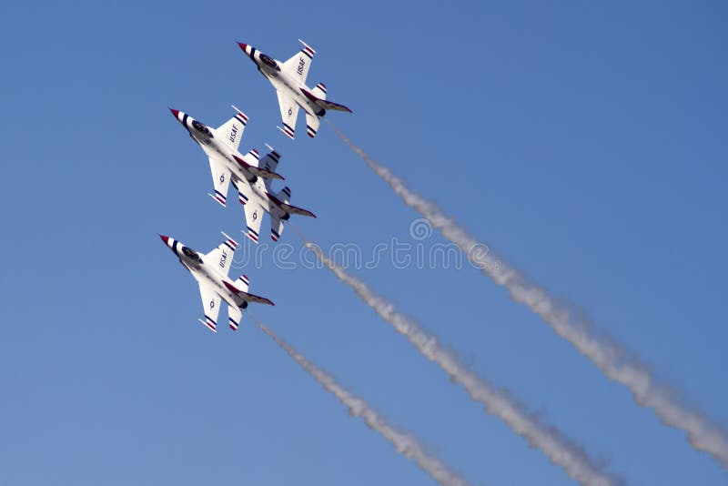 The United States Air Force Thunderbirds Air Demonstration Squadron performs for spectators at Luke Air Force Base in Glendale, Arizona, USA. These highly trained United State Air Force pilots fly in very close high precision aerobatic formations in air shows throughout the United States and around the world. The name Thunderbird is derived from a legendary creature from myths of indigenous North American cultures. The Thunderbirds fly specially marked F-16's. The F-16 (Fighting Falcon) is a very prominent and successful jet fighter aircraft developed by General Dynamics and Lockheed Martin of the United States. Designed as a lightweight fighter, it has evolved to being a highly successful multirole aircraft. In addition to air demonstrations, the USAF Thunderbirds are part of the Air Force combat forces and a component of the 57th Wing. If needed, the team's personnel and aircraft can be rapidly integrated into a fighter unit at their home base Nellis Air Force Base, Nevada. The United States Air Force Thunderbirds Air Demonstration Squadron performs for spectators at Luke Air Force Base in Glendale, Arizona, USA. These highly trained United State Air Force pilots fly in very close high precision aerobatic formations in air shows throughout the United States and around the world. The name Thunderbird is derived from a legendary creature from myths of indigenous North American cultures. The Thunderbirds fly specially marked F-16's. The F-16 (Fighting Falcon) is a very prominent and successful jet fighter aircraft developed by General Dynamics and Lockheed Martin of the United States. Designed as a lightweight fighter, it has evolved to being a highly successful multirole aircraft. In addition to air demonstrations, the USAF Thunderbirds are part of the Air Force combat forces and a component of the 57th Wing. If needed, the team's personnel and aircraft can be rapidly integrated into a fighter unit at their home base Nellis Air Force Base, Nevada.