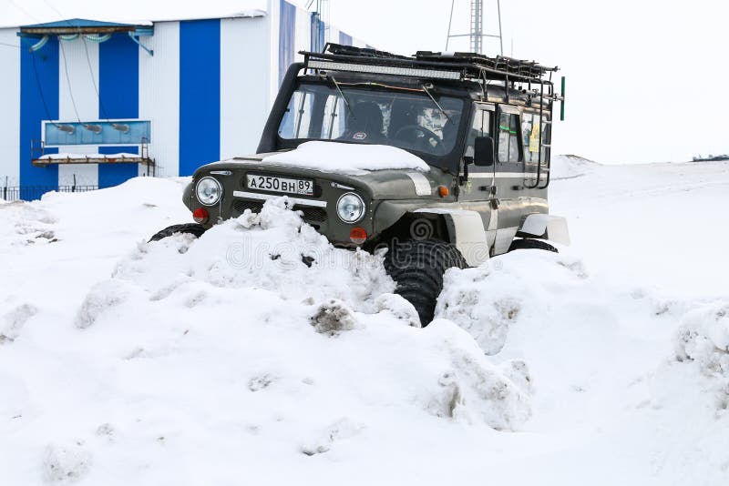 Novyy Urengoy, Russia - April 2, 2020: Offroad car UAZ 31512 covered with snow
