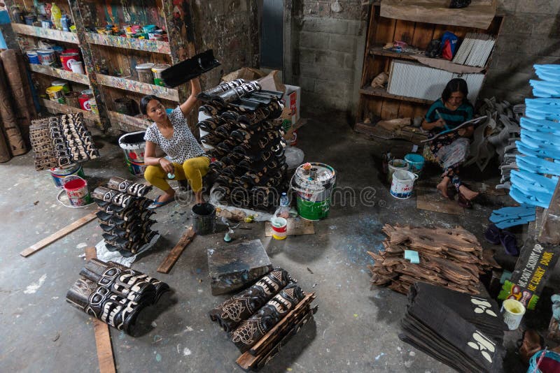UBUD/BALI-APRIL 27 2019: Female workers from Ubud were making mask crafts that were drawn and colored using dark and attractive stock photo UBUD/BALI-APRIL 27 2019: Female workers from Ubud were making mask crafts that were drawn and colored using dark and attractive stock photo