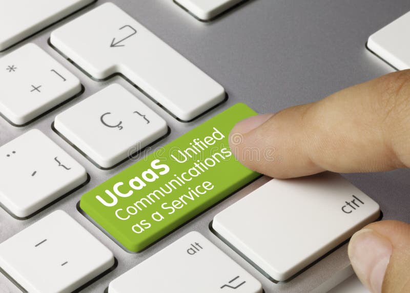 UCaaS Unified Communications as a Service Written on Green Key of Metallic Keyboard. Finger pressing key. UCaaS Unified Communications as a Service Written on Green Key of Metallic Keyboard. Finger pressing key