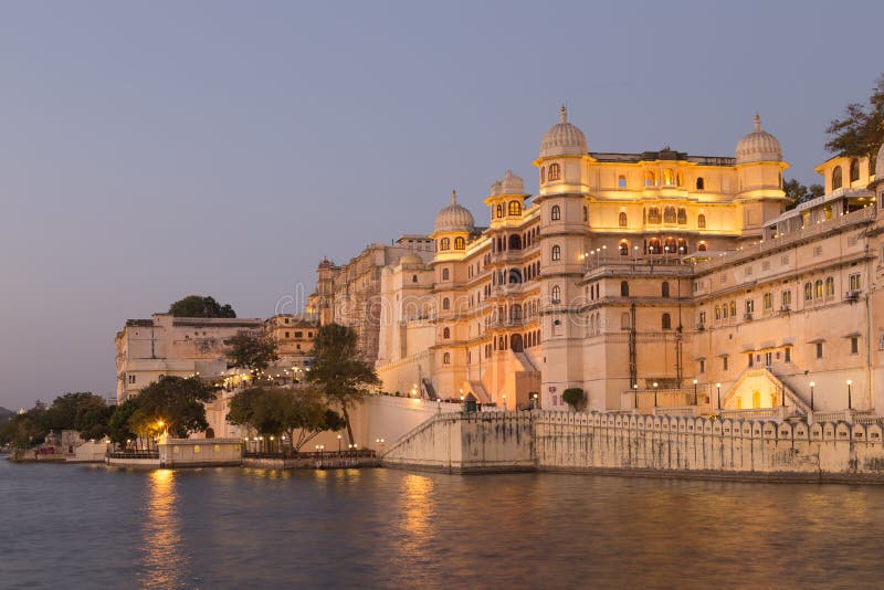 This photo was shot from Udaipur city at twilight time. Udaipur city palace was built over a period of nearly 400 years being contributed by several kings of the dynasty. It is located on the east bank of the Lake Pichola and has several palaces built within its complex. This photo was shot from Udaipur city at twilight time. Udaipur city palace was built over a period of nearly 400 years being contributed by several kings of the dynasty. It is located on the east bank of the Lake Pichola and has several palaces built within its complex.