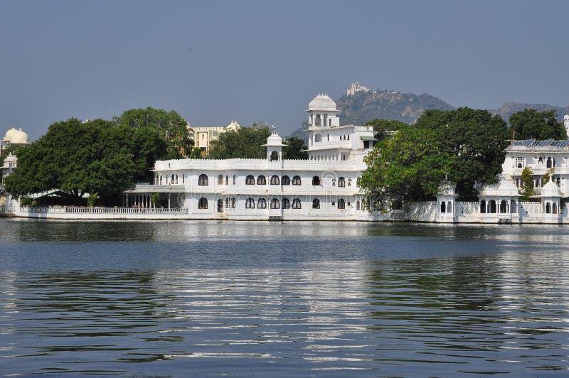 City of Udaipur, Rajasthan, India. Old Indian luxurious palace hotel at the lake front. Traditional architecture. City of Udaipur, Rajasthan, India. Old Indian luxurious palace hotel at the lake front. Traditional architecture