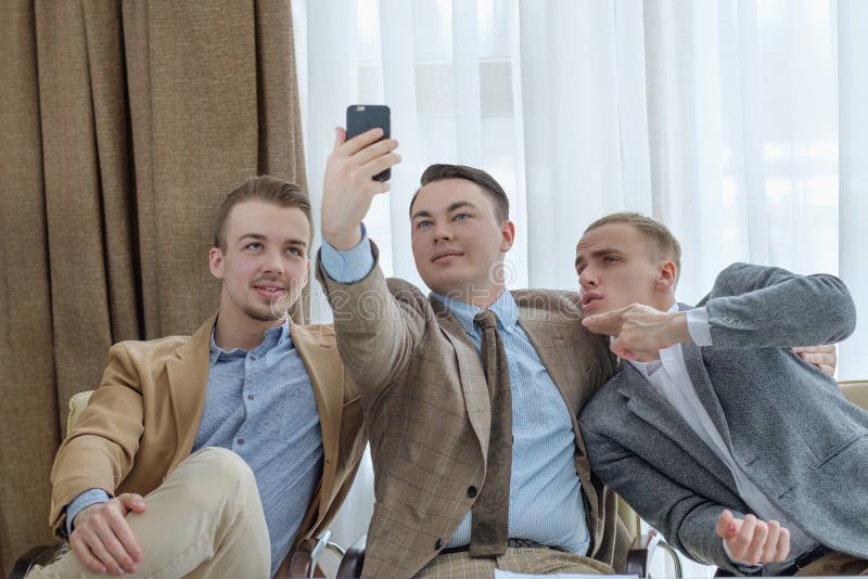 Selfie time. social network addiction. life oversharing lifestyle. business men taking photos of themselves in the office. Selfie time. social network addiction. life oversharing lifestyle. business men taking photos of themselves in the office
