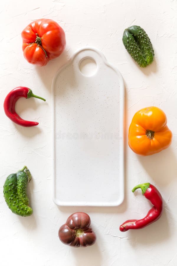 Ugly organic colorful tomato, pepper, cucumber on white stock images