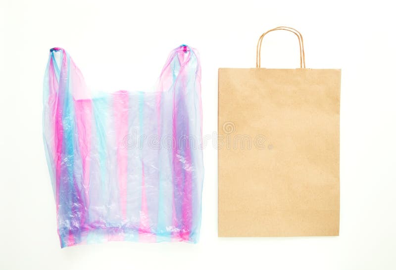 Ugly plastic bag vs brown paper recyclable bag. Reduce, Reuse and Recycle concept. Flat lay royalty free stock photos