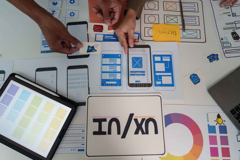 UI UX Design Collaboration. Team brainstorming and creating mobile app prototypes. royalty free stock photos