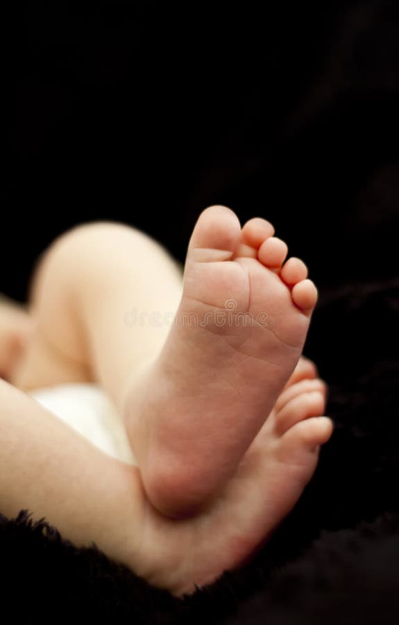 Small little tiny newborn baby feet. Small little tiny newborn baby feet.