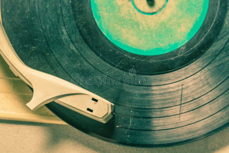 Vintage record player with few black vinyl records on old table. Vintage record player with few black vinyl records on old table