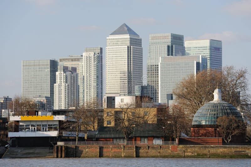 Canary Wharf, the other financial business district in London, England, UK, Europe, on a winter afternoon, from Greenwich looking over the Thames to the Isle of Dogs. On the bottom right is the northern entrance to the Greenwich Foot Tunnel. Canary Wharf, the other financial business district in London, England, UK, Europe, on a winter afternoon, from Greenwich looking over the Thames to the Isle of Dogs. On the bottom right is the northern entrance to the Greenwich Foot Tunnel.