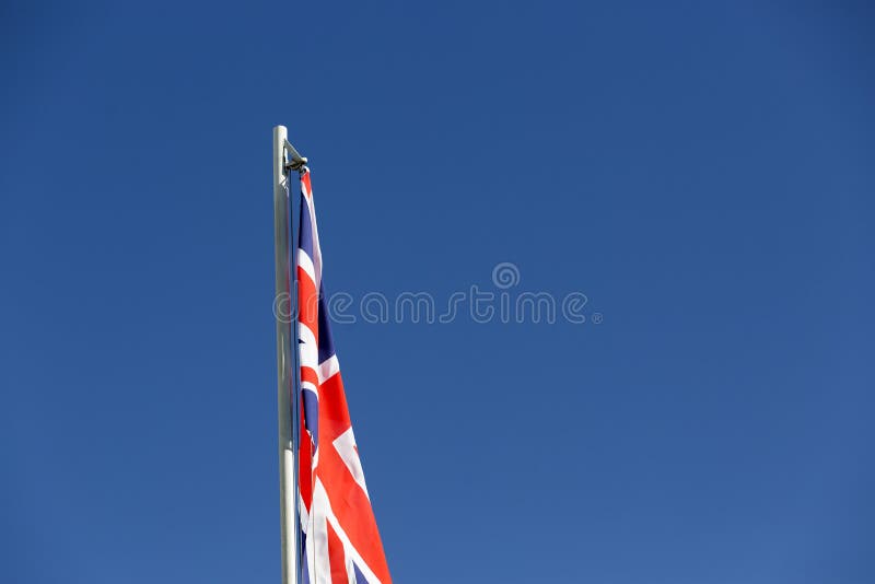 UK flag on a flagpole stock image. Image of motion, flag 87399849
