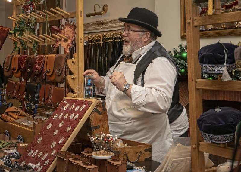 Marker trading selling leather goods dressed in as a victorian s
