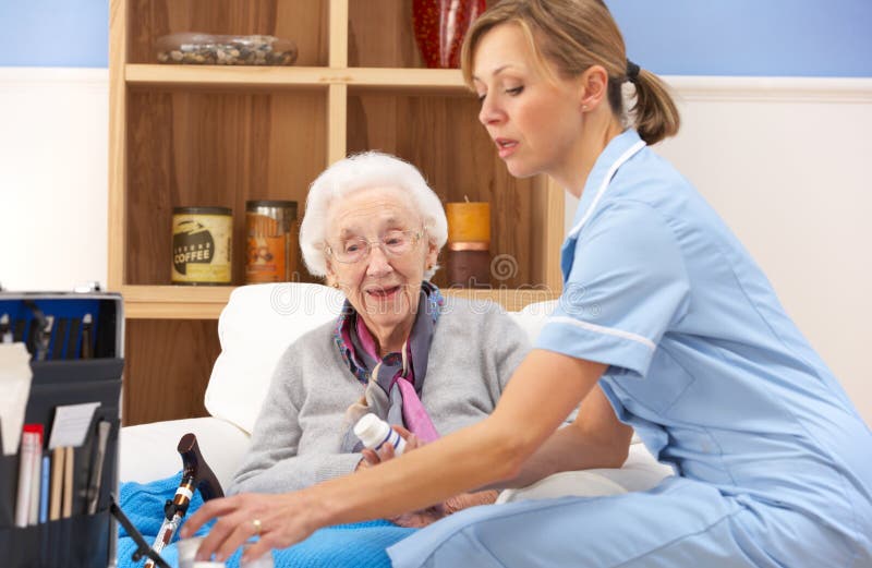 UK Nurse Visiting Senior Woman At Home Stock Image - Image of visit