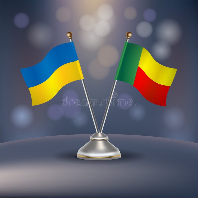 Ukraine vs benin-flaggrelation i ett stativ på bordet royaltyfri illustrationer