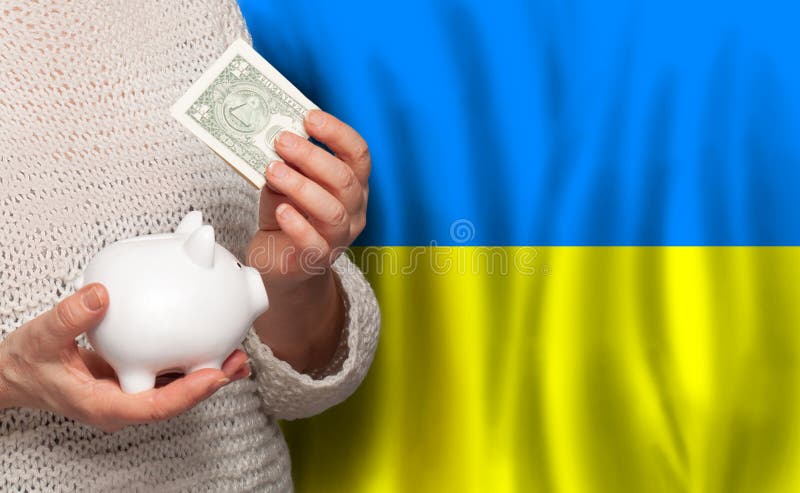 Ukrainian Woman with Money Bank on the Background of Ukraine Flag