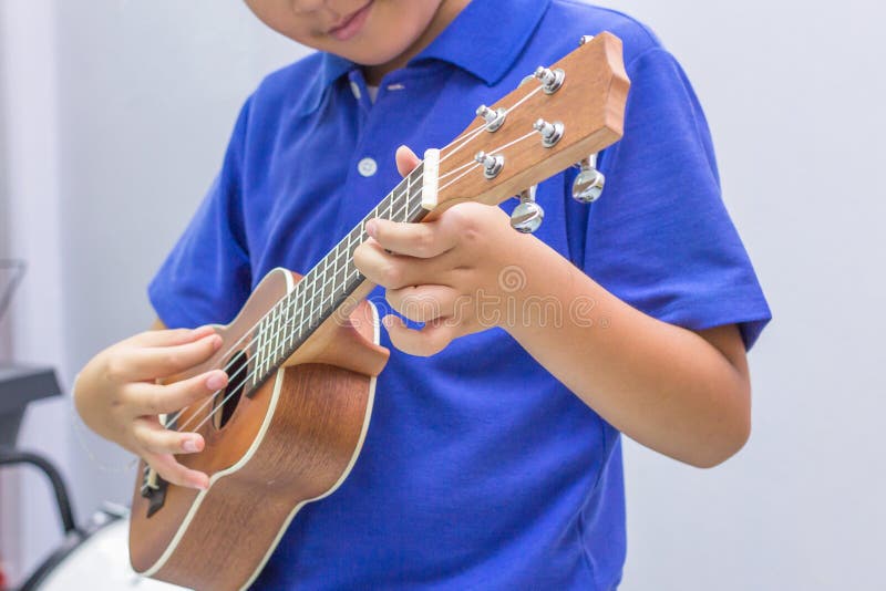 The Ukulele boy stock photo. Image of ukulele, acoustic 64105390