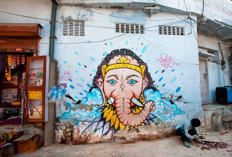 Uliczni graffiti z władyką Ganesh na błękitnej ścianie obrazy stock Uliczni graffiti z władyką Ganesh na błękitnej ścianie obrazy stock