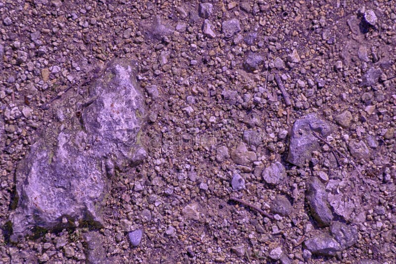 Ultra purple Ground like on Mars, land texture, sand surface, stone background royalty free stock photo