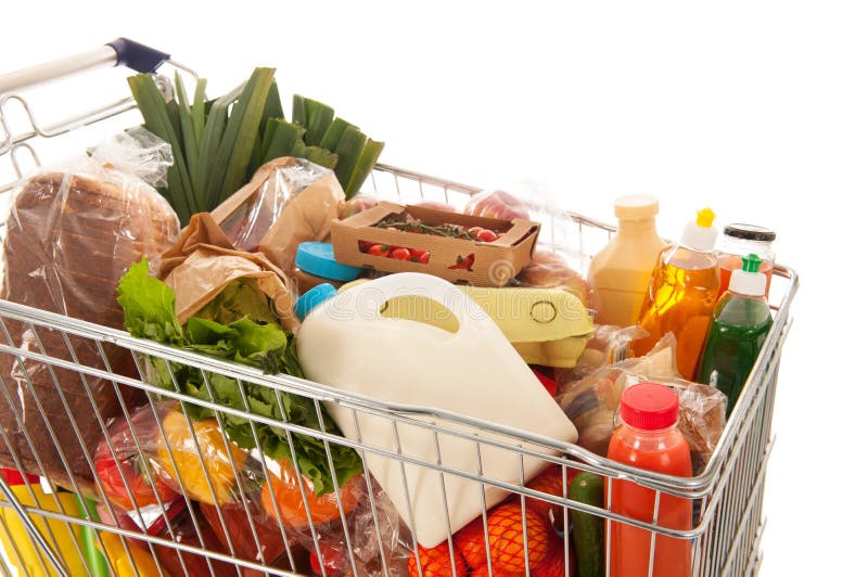 Shopping cart full with dairy grocery products isolated over white background. Shopping cart full with dairy grocery products isolated over white background