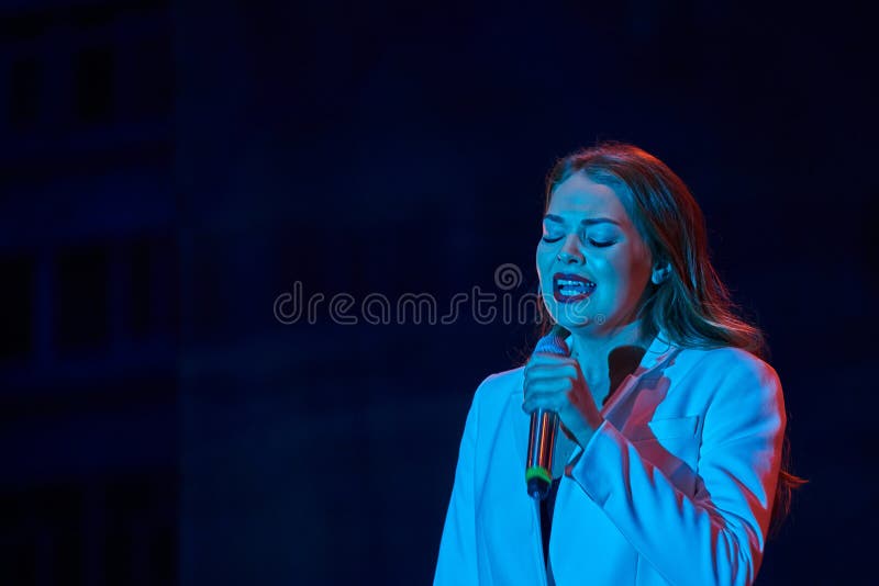 Ulyanovsk, Russia - August 18, 2018. Solo performance of the pop singer Guzeli Hasanoy at a street concert. stock image Ulyanovsk, Russia - August 18, 2018. Solo performance of the pop singer Guzeli Hasanoy at a street concert. stock image