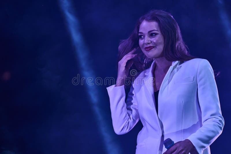 Ulyanovsk, Russia - August 18, 2018. Solo performance of the pop singer Guzeli Hasanoy at a street concert. stock photo Ulyanovsk, Russia - August 18, 2018. Solo performance of the pop singer Guzeli Hasanoy at a street concert. stock photo