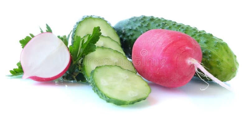 A set of basic ingredients for preparing a vitamin salad on a light background. The set of vegetables includes radish and cucumber. Chicken eggs, spring onions, parsley and dill are usually added to the vegetable salad, everything is finely chopped and greased with vegetable oil, ground black pepper, salt, and spices are added to taste. Red and green colors predominate. A set of basic ingredients for preparing a vitamin salad on a light background. The set of vegetables includes radish and cucumber. Chicken eggs, spring onions, parsley and dill are usually added to the vegetable salad, everything is finely chopped and greased with vegetable oil, ground black pepper, salt, and spices are added to taste. Red and green colors predominate.