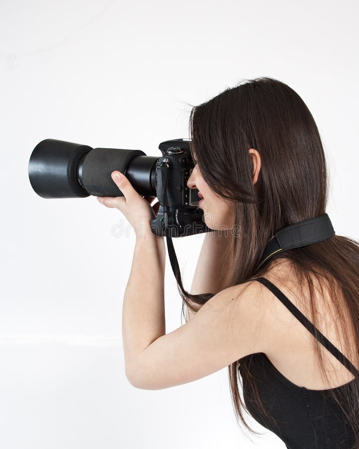 Um fotógrafo fêmea novo fotografia de stock Um fotógrafo fêmea novo fotografia de stock